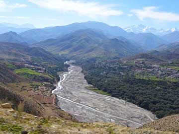 Morocco: View of large modern river feeding from the High Atlas. The research is trying to determine where and how big the river systems were in the Cretaceous, 150 million years ago.