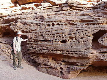 Libya: Large-scale, low-angle cross bedding, Messak Formation. Dr Jonathan Wood for scale.